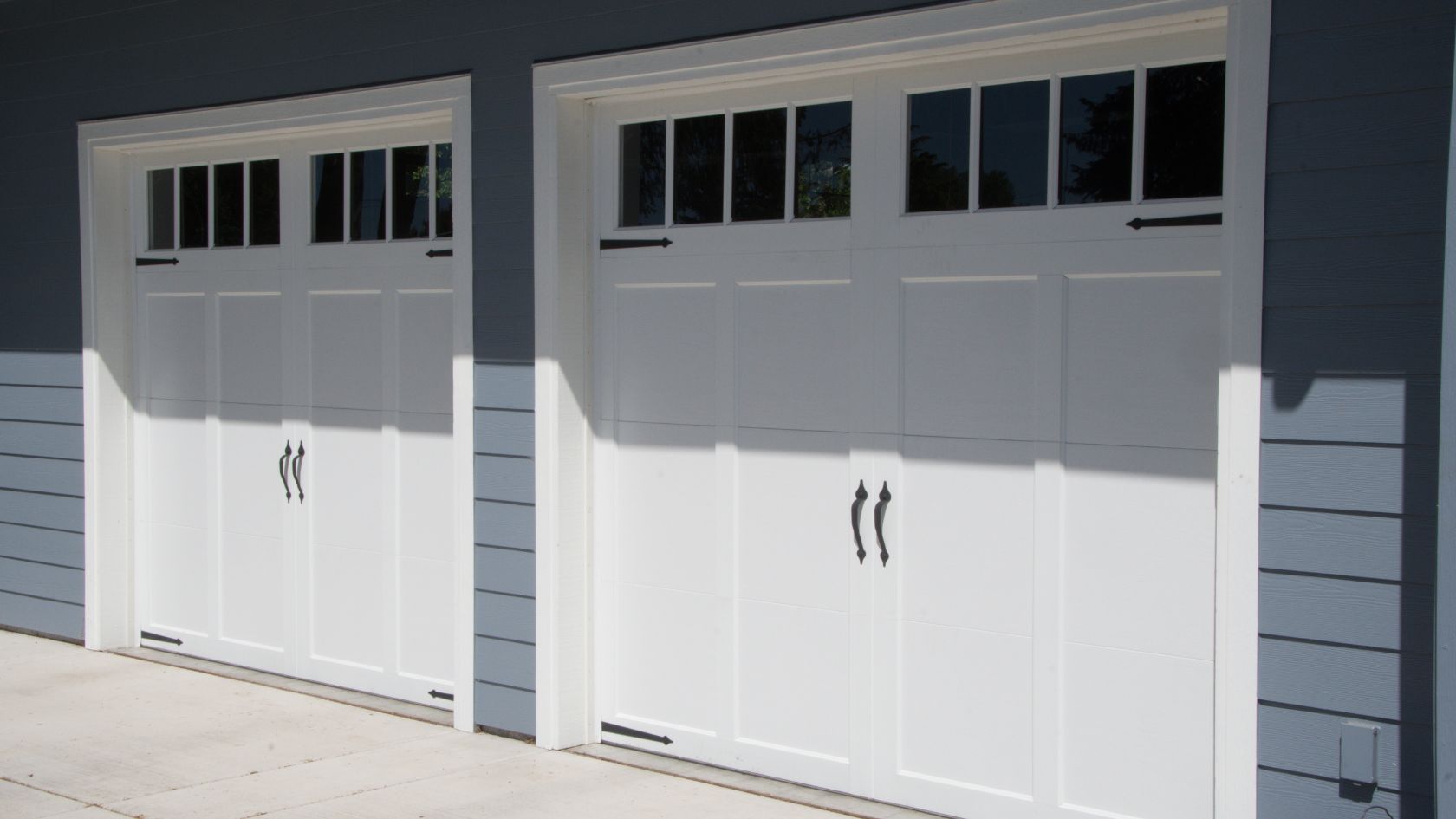 A couple of garage doors sitting next to each other